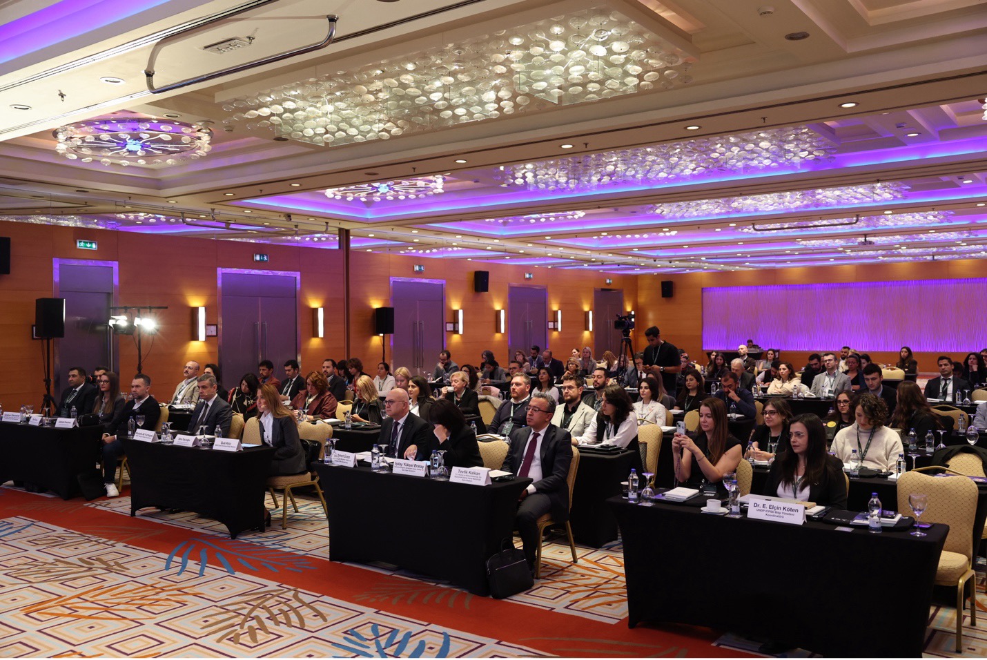 Participants listening to opening remarks